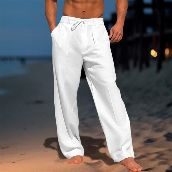 Men's relaxed fit drawstring pants in a light color, ideal for spring casual wear or travel comfort.
