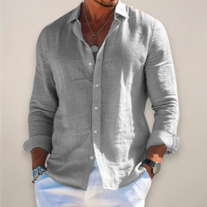 Casual men's long sleeve button-up shirt for summer comfort. Relaxed fit menswear essential.
