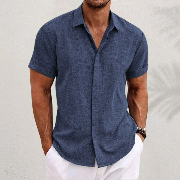 Comfortable men's button-down summer shirt with short sleeves, great for casual warm weather outfits.