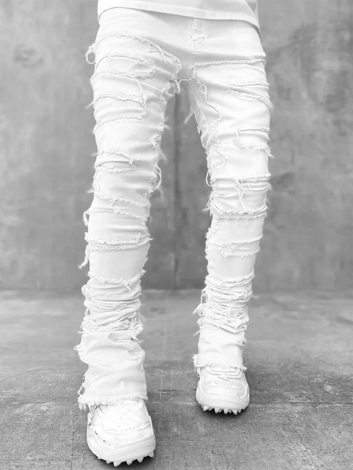 Cool men's white slim fit ripped jeans, ideal for casual urban style. Comfortable distressed denim pants.