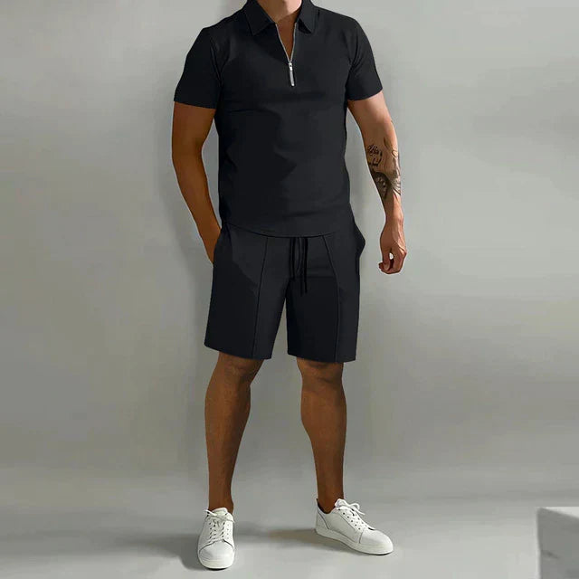 Men's smart summer outfit: matching two-piece zippered polo & drawstring shorts set. Casual & comfortable for warm weather.