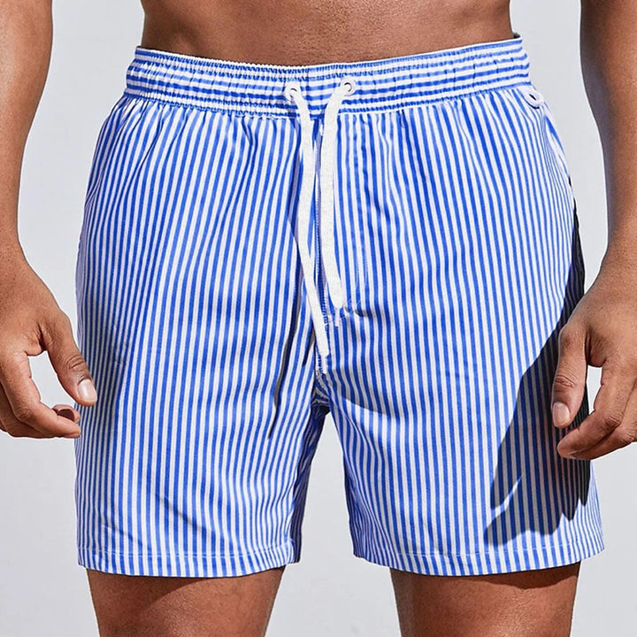 New colorful men's summer shorts, offering stylish comfort & relaxed fit. Ideal casual beachwear for warm weather.