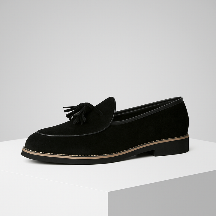 Pair of mens navy blue suede tassel loafers, showcasing their elegant design and slip-on style.
