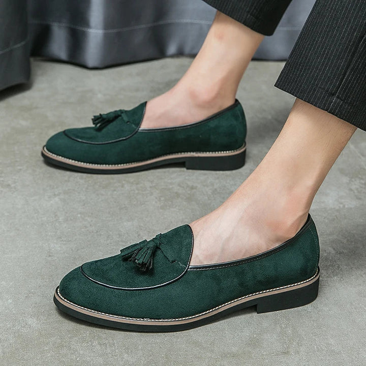 Detail of the tassel on a men's suede loafer, highlighting the craftsmanship of these formal shoes.