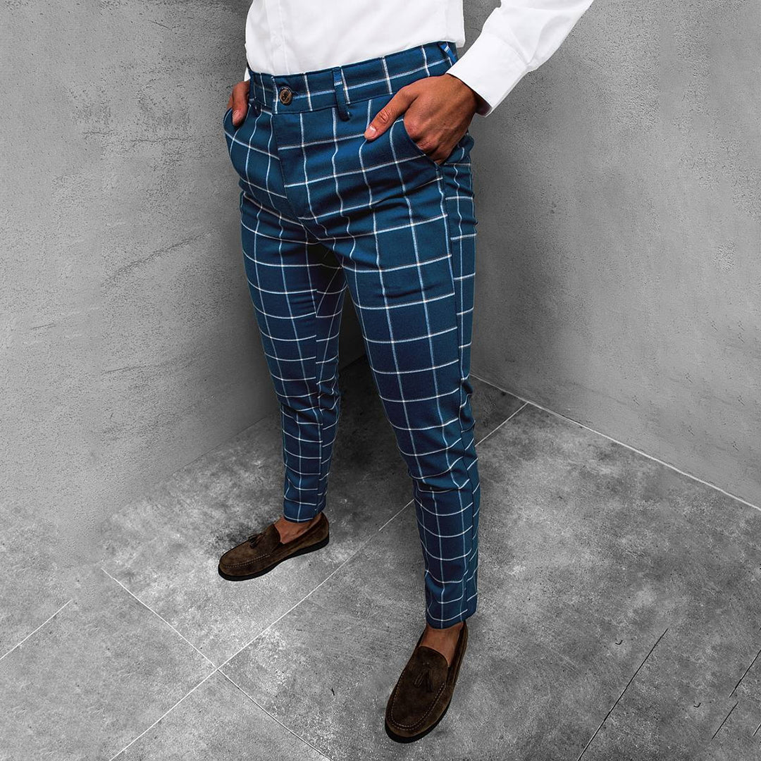 Full-length view of men's grid pattern tapered trousers, ideal for office or casual