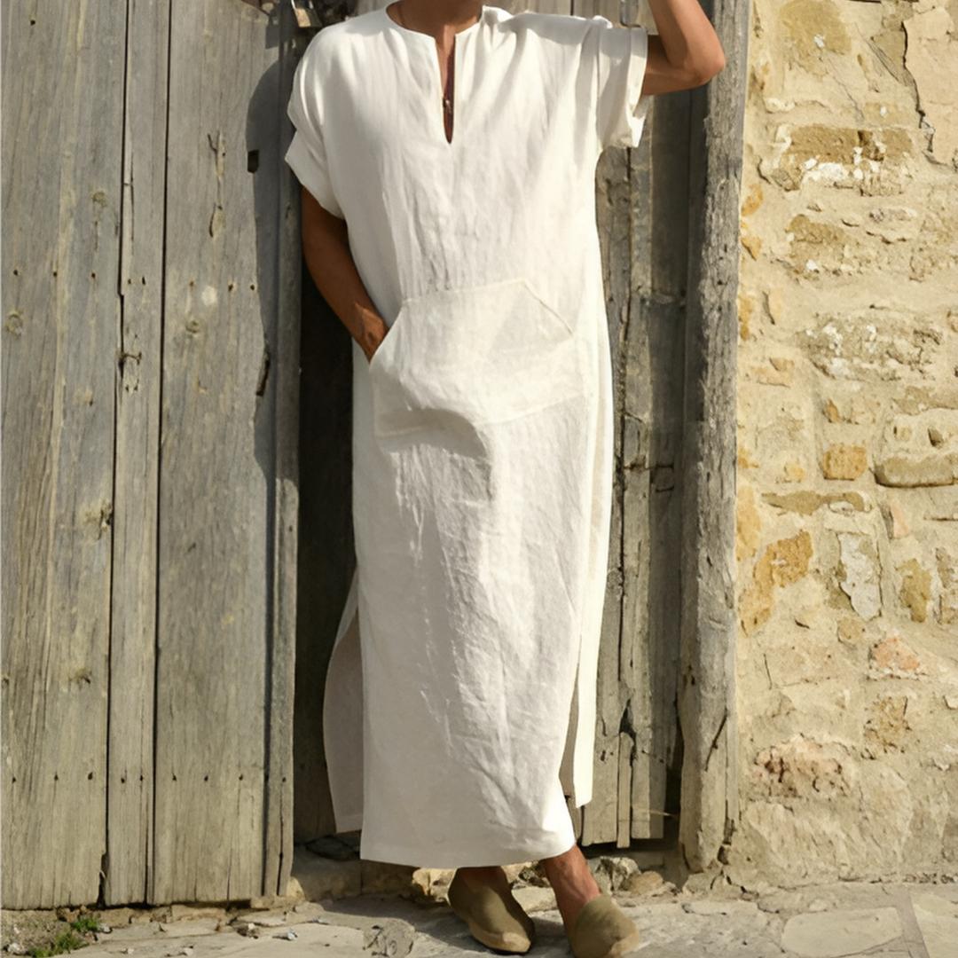 Modern men's V-neck long shirt featuring side slits and a utility pocket. Ideal for effortless casual style.