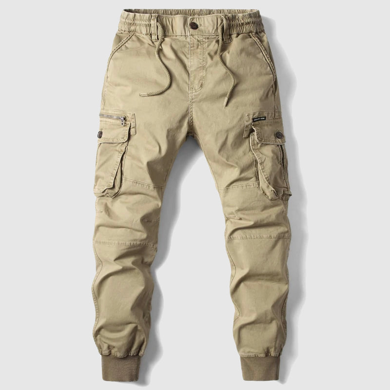 Close-up of men's cargo jogger pants pockets with durable fabric, highlighting utility and style.