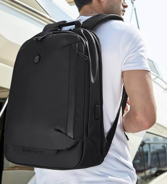 Man commuting with a durable water-resistant anti-theft travel backpack. Ideal for daily use & outdoor trips.