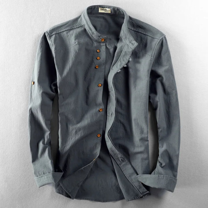 Man's arm wearing a white cotton-linen long sleeve band collar shirt, comfortable fit