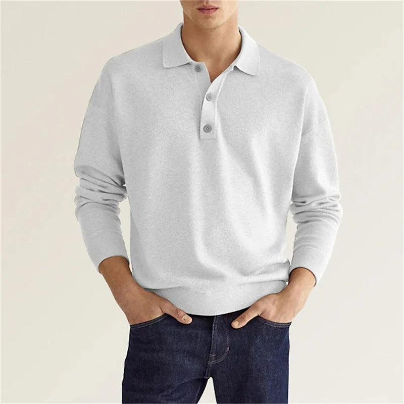 Folded men's colorblock crew sweater, ready for purchase; a key winter fashion item