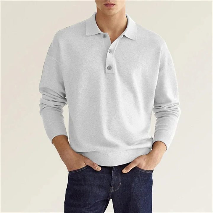 Folded men's colorblock crew sweater, ready for purchase; a key winter fashion item