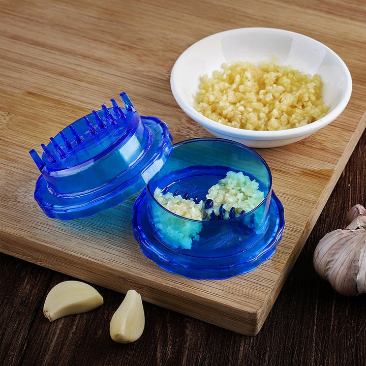 Durable manual garlic press and mincer, essential kitchen utensil for fresh garlic