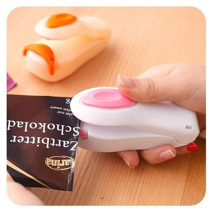Kitchen counter with a mini portable food bag heat sealer, demonstrating its role as a practical kitchen gadget.