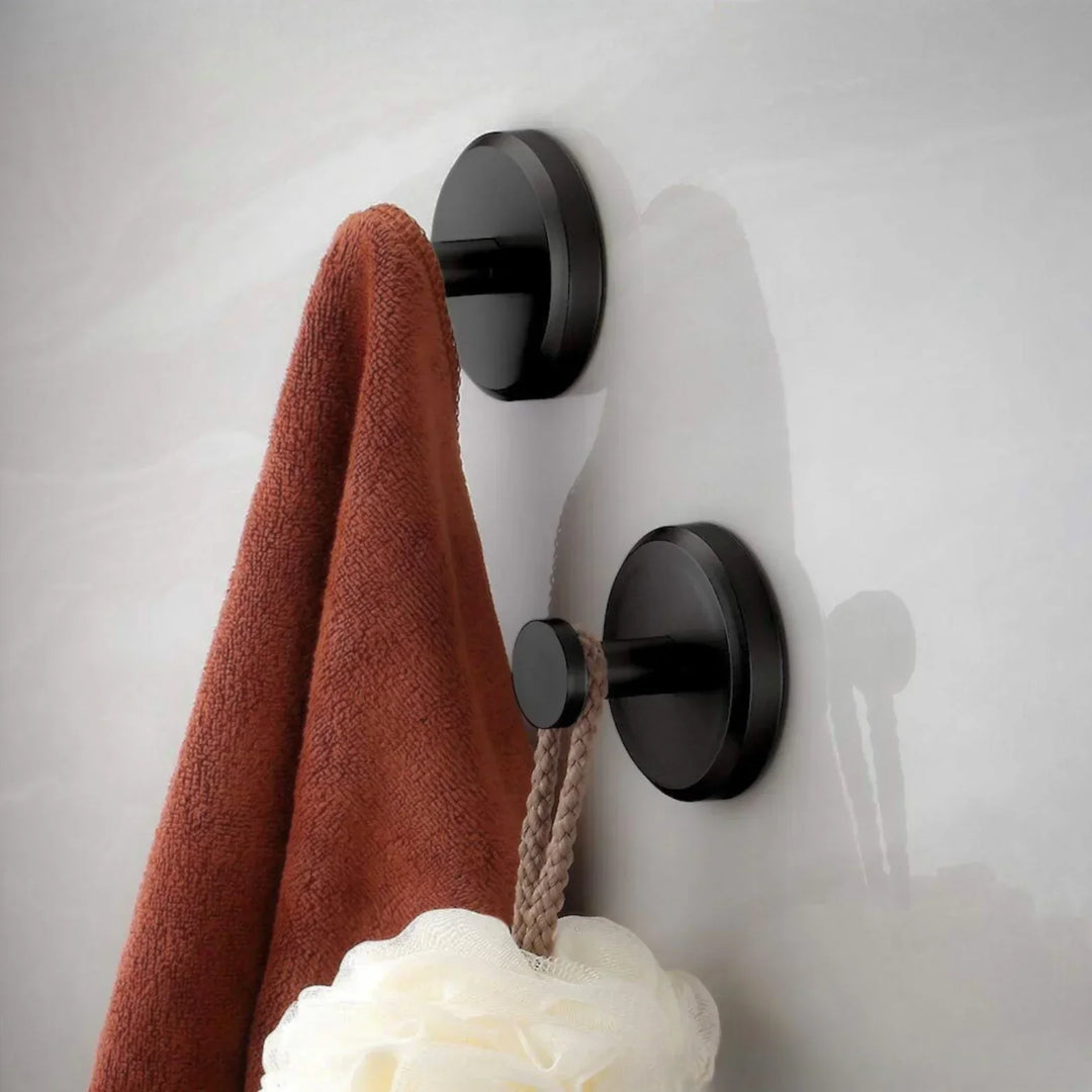 "Minimalist suction wall hooks 4-pack, no-drill installation for modern home, stylish organization, supports up to 7 kg."
