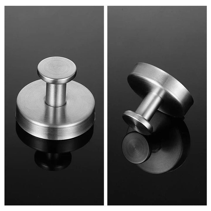 "Minimalist suction wall hooks 4-pack, no-drill installation for modern home, stylish organization, supports up to 7 kg."