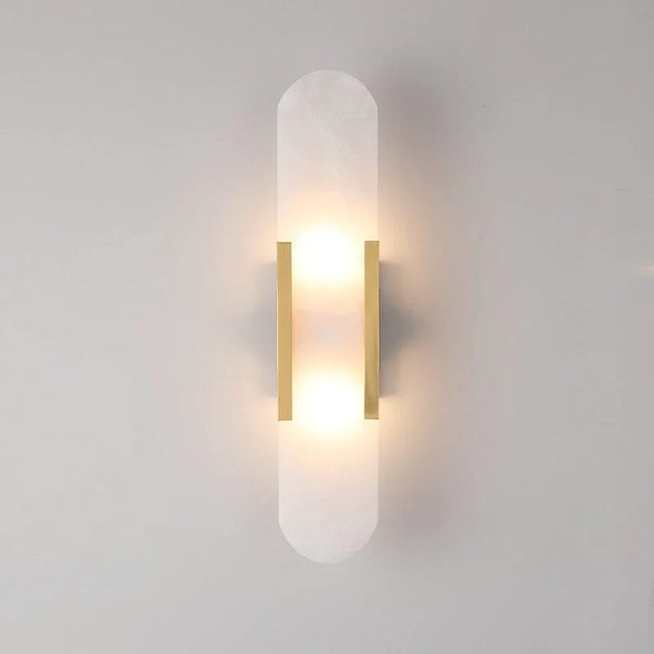 "Modern black and gold LED wall lamp with oval Lucite crystal centerpiece, ideal for dining room lighting."