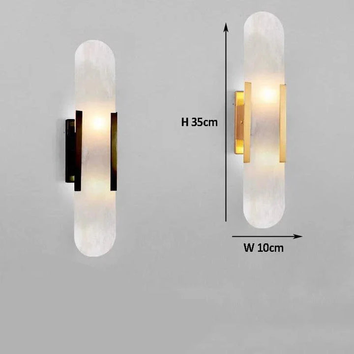 "Modern black and gold LED wall lamp with oval Lucite crystal centerpiece, ideal for dining room lighting."