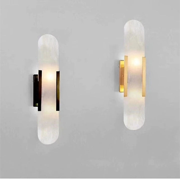 "Modern black and gold LED wall lamp with oval Lucite crystal centerpiece, ideal for dining room lighting."