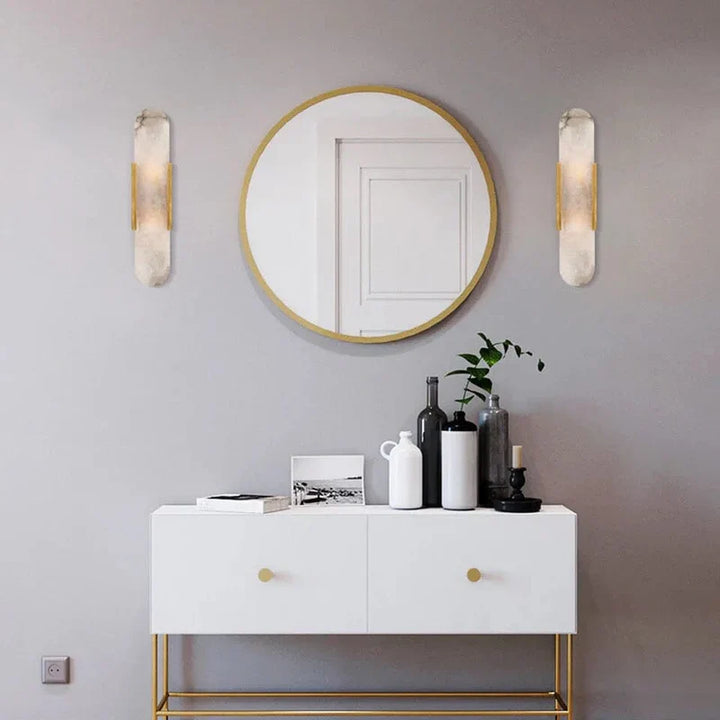 "Modern black and gold LED wall lamp with oval Lucite crystal centerpiece, ideal for dining room lighting."