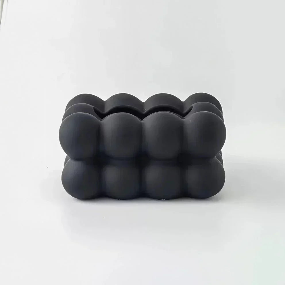 "Modern bubble ceramic tissue box with playful design, elegant porcelain finish, ideal for home or office decor."