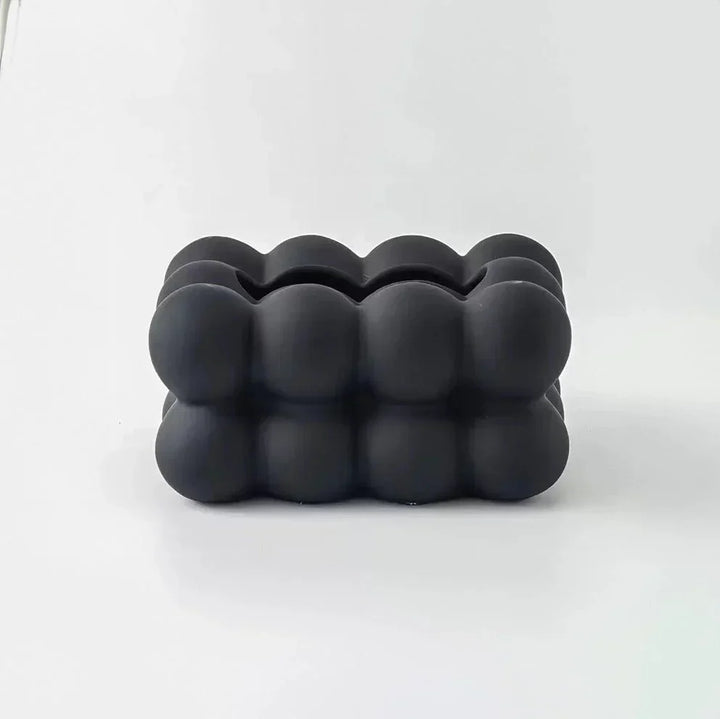 "Modern bubble ceramic tissue box with playful design, elegant porcelain finish, ideal for home or office decor."