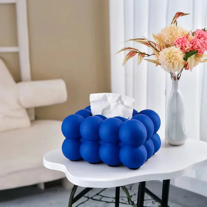 "Modern bubble ceramic tissue box with playful design, elegant porcelain finish, ideal for home or office decor."