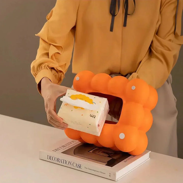 "Modern bubble ceramic tissue box with playful design, elegant porcelain finish, ideal for home or office decor."
