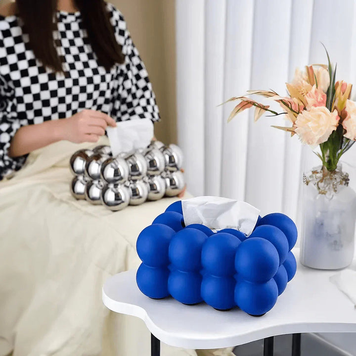 "Modern bubble ceramic tissue box with playful design, elegant porcelain finish, ideal for home or office decor."