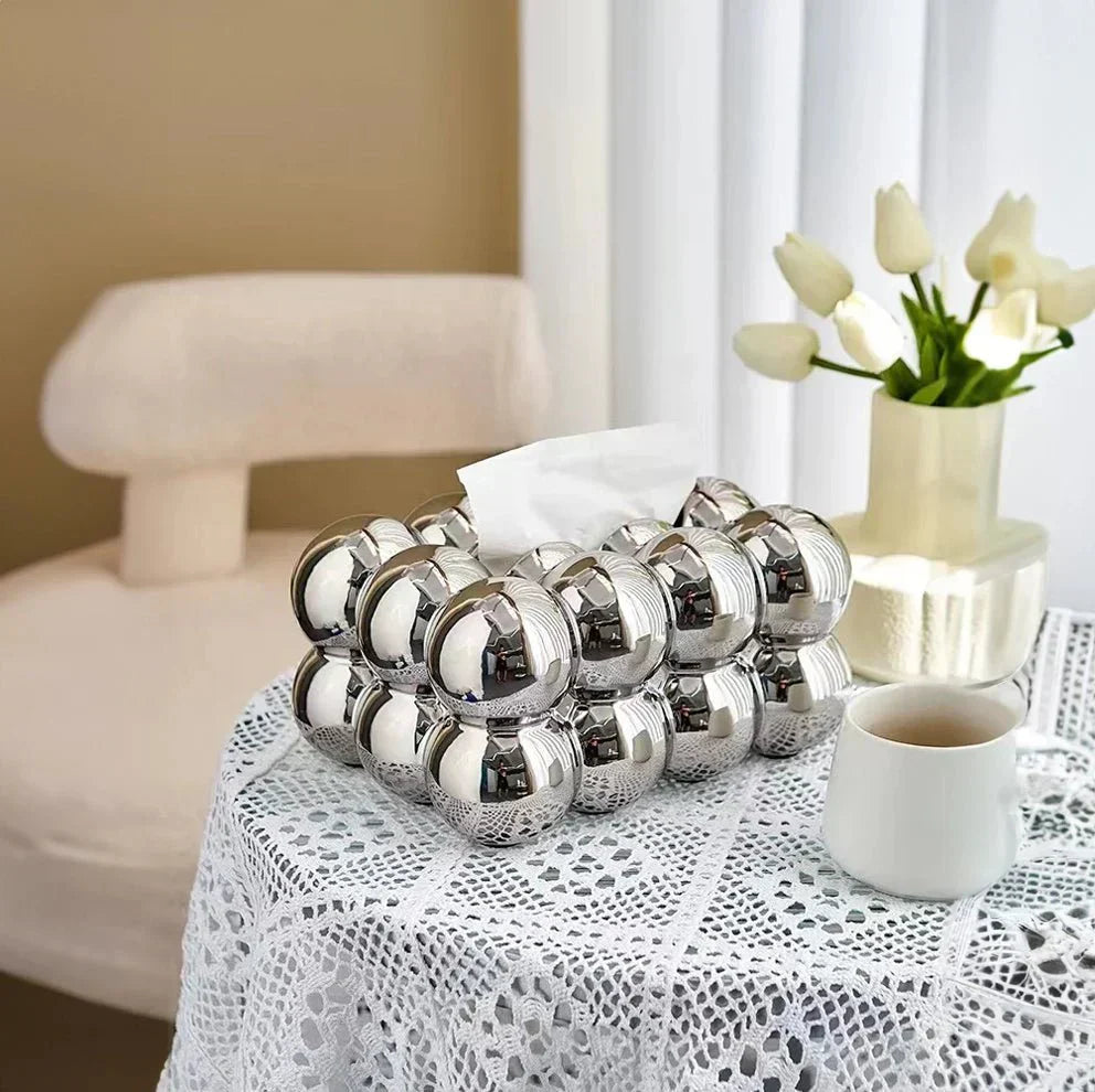 "Modern bubble ceramic tissue box with playful design, elegant porcelain finish, ideal for home or office decor."