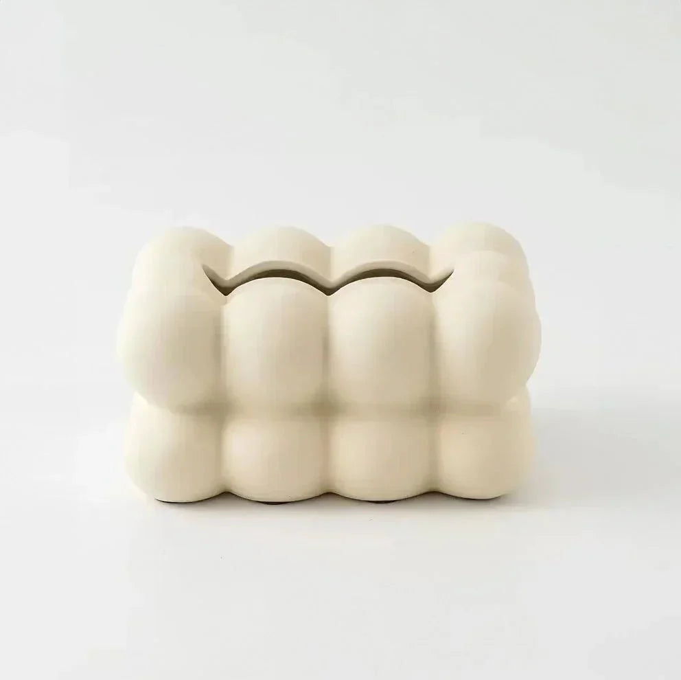 "Modern bubble ceramic tissue box with playful design, elegant porcelain finish, ideal for home or office decor."