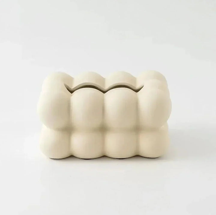 "Modern bubble ceramic tissue box with playful design, elegant porcelain finish, ideal for home or office decor."