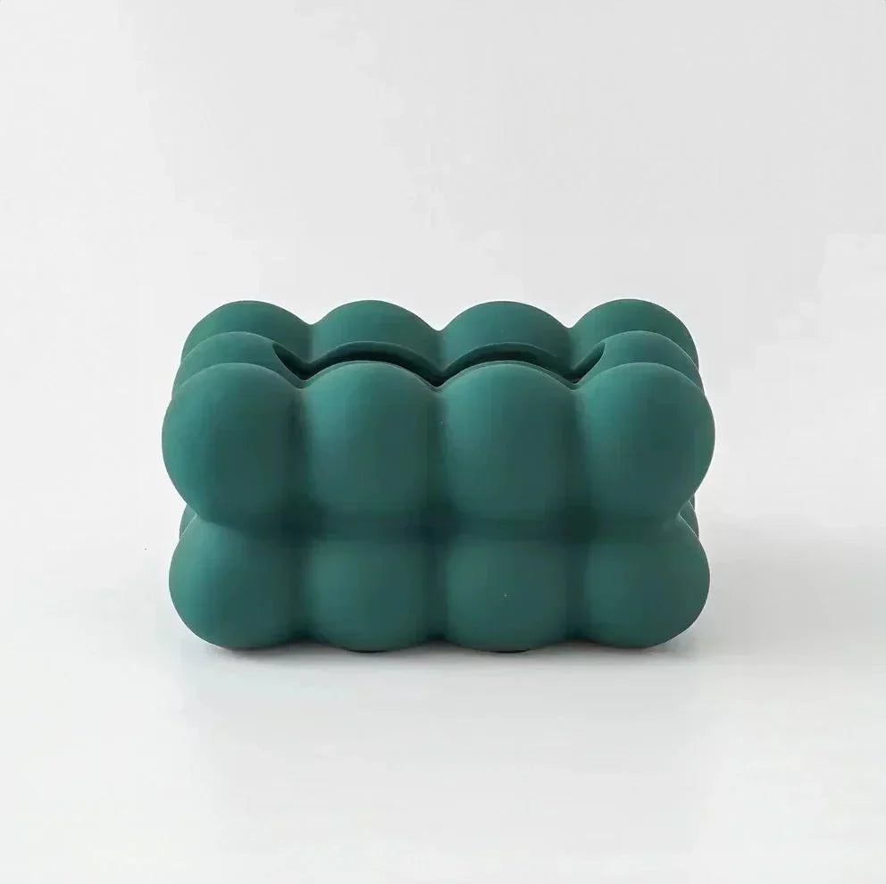 "Modern bubble ceramic tissue box with playful design, elegant porcelain finish, ideal for home or office decor."
