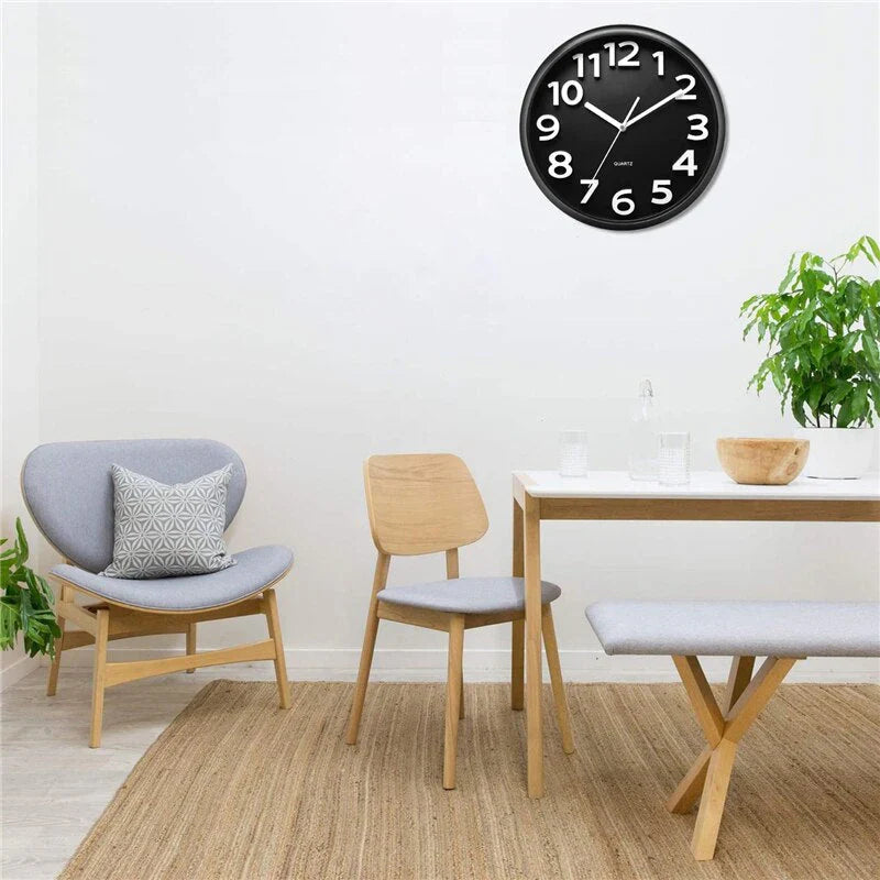 "Modern minimalist wall clock with sleek design, black frame, clean lines, perfect for contemporary home decor."