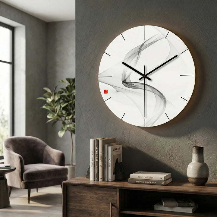 Front view of a round illuminated clock, highlighting its minimalist design.