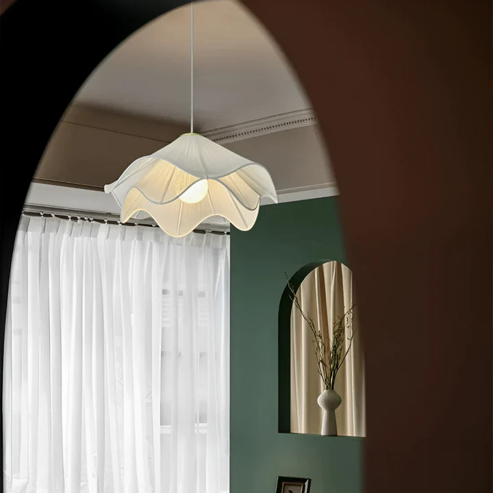 Modern white fabric flower LED pendant light with elegant design, soft glow, ideal for chic interiors, adjustable length.