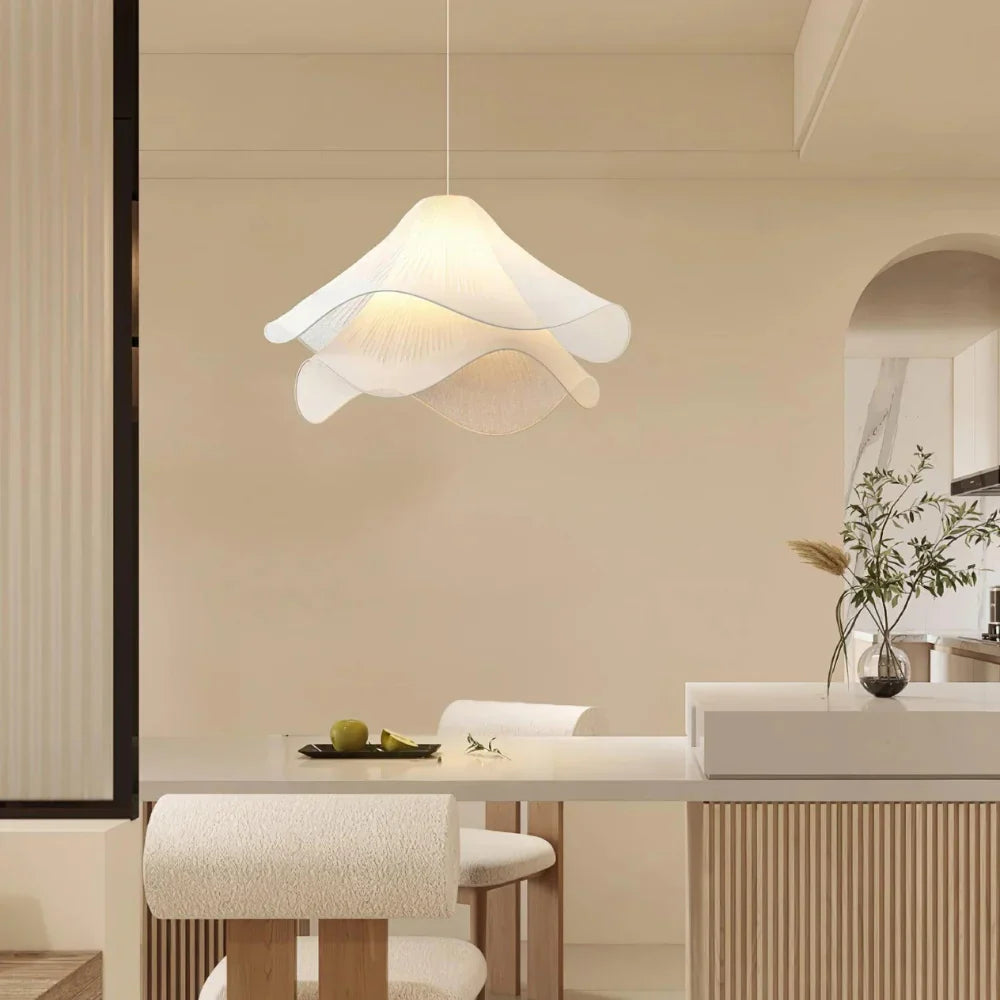 Modern white fabric flower LED pendant light with elegant design, soft glow, ideal for chic interiors, adjustable length.