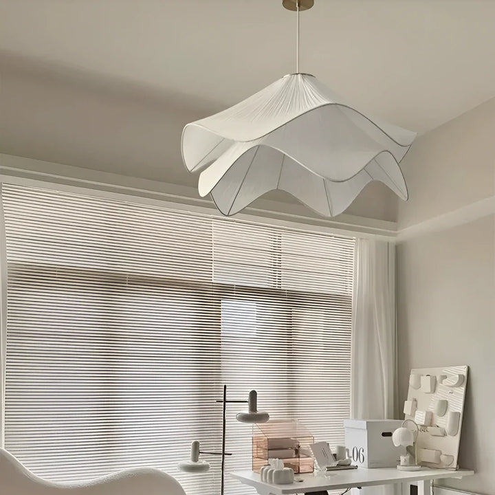 Modern white fabric flower LED pendant light with elegant design, soft glow, ideal for chic interiors, adjustable length.