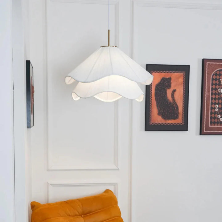 Modern white fabric flower LED pendant light with elegant design, soft glow, ideal for chic interiors, adjustable length.