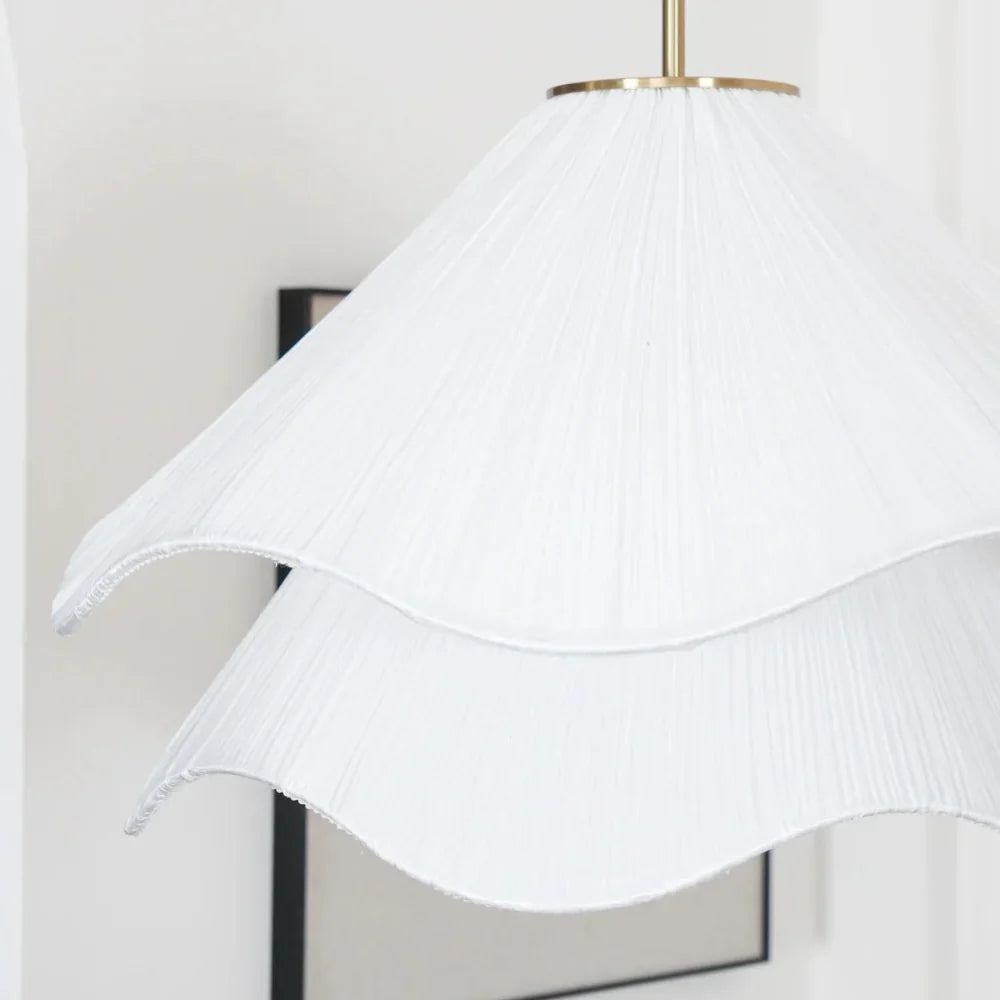 Modern white fabric flower LED pendant light with elegant design, soft glow, ideal for chic interiors, adjustable length.
