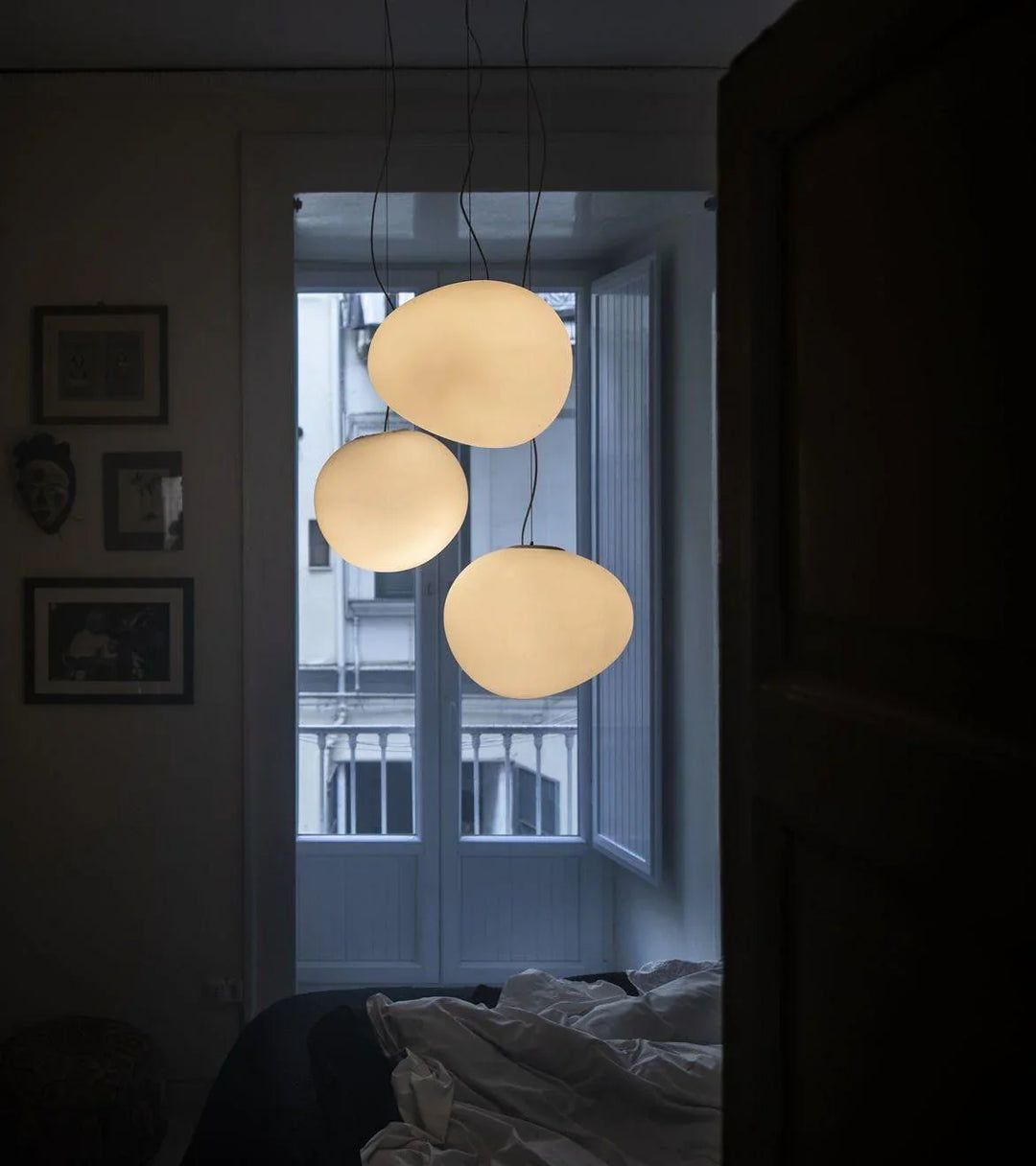 "Modern white glass globe pendant light, spherical design, elegant home decor, warm glow, perfect for living and dining areas