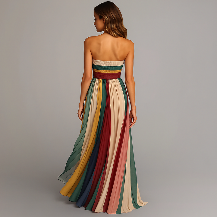 Elegant women's strapless maxi dress featuring a beautiful multicolor bohemian print and flowing pleats. Summer ready.