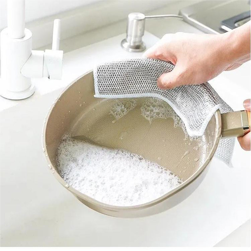 Non-scratch metal fiber dishcloth in use, demonstrating effective cleaning without damage