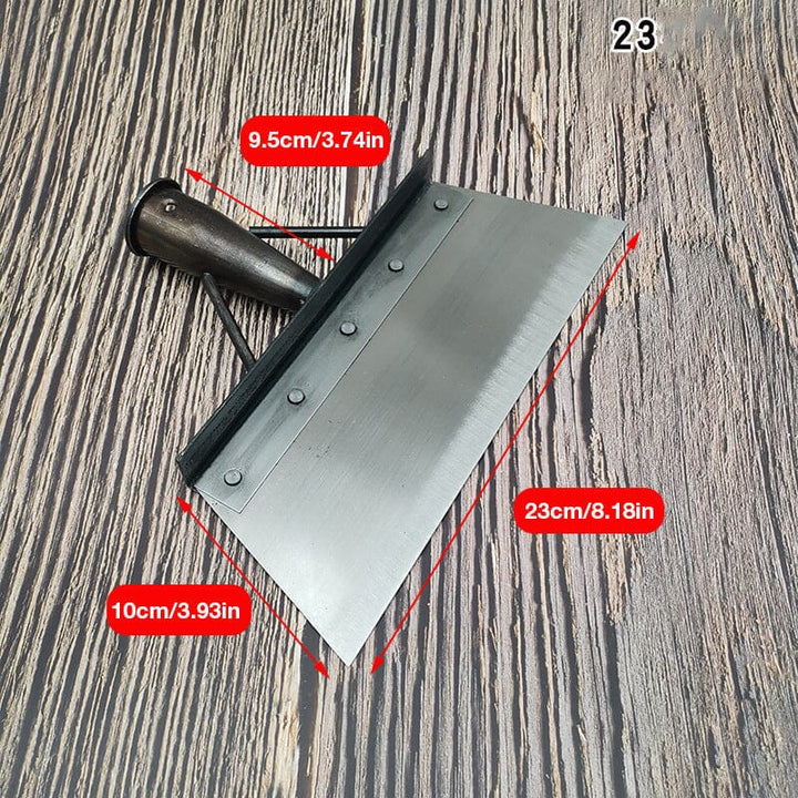 User effectively removing weeds with the multipurpose stainless steel scraper