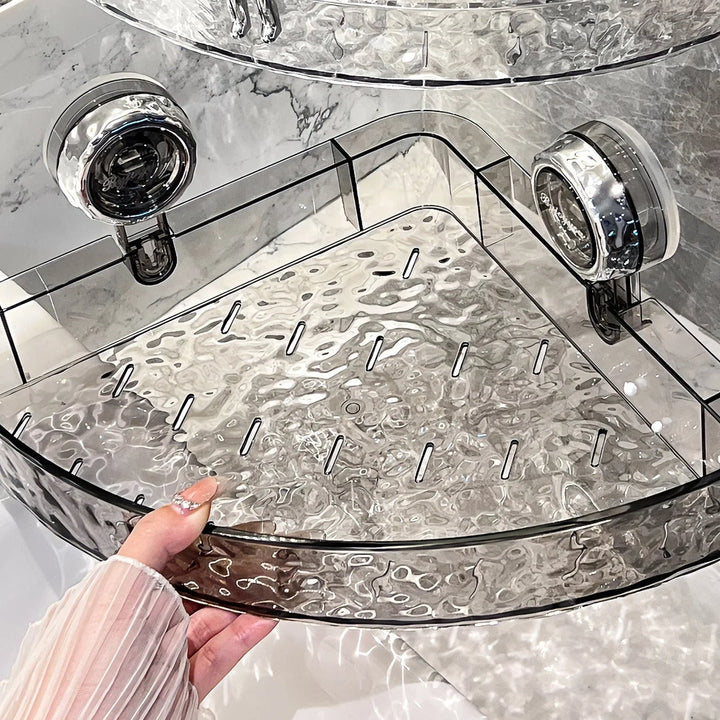 "No-drill wall storage with strong suction cups; transparent, holds heavy items securely, sleek design for bathroom use."
