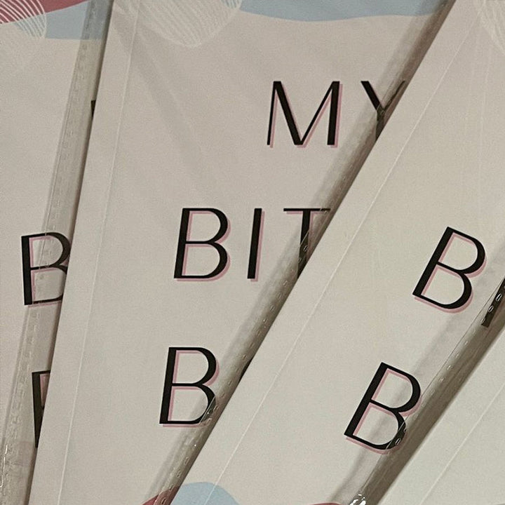 Stack of adult stress relief journals, perfect for self-care and gratitude