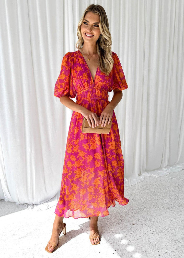 Flattering women's floral midi dress with puff sleeves & v-neck. Ideal for special occasions, parties or summer guests.