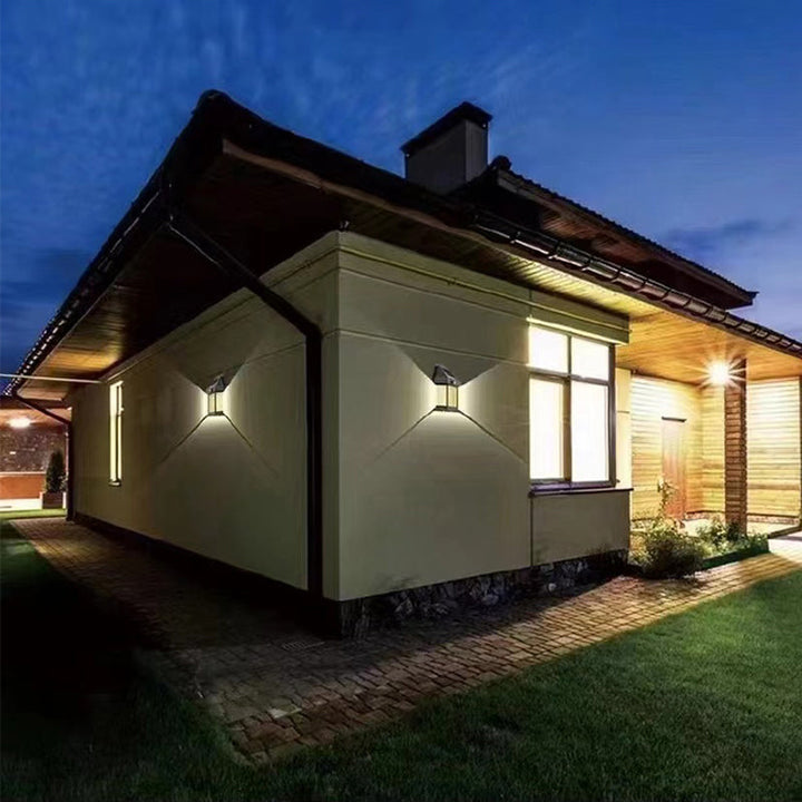 Outdoor solar wall light with wide-angle illumination for garden or patio