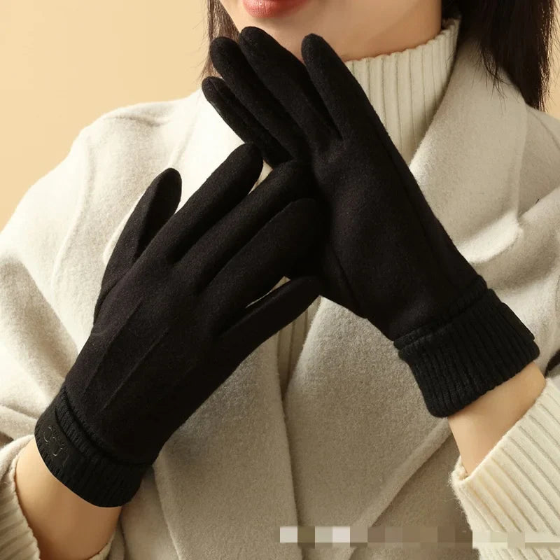 Male hand wearing a black cashmere touchscreen winter glove, demonstrating comfort and style.