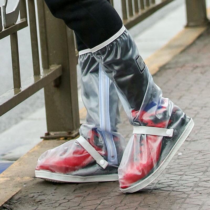 Close-up of waterproof shoe covers in blue, showing elastic top and non-slip sole for outdoor use