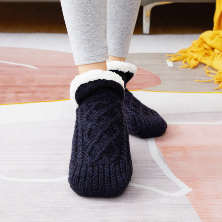 Gift-ready packaging for a pair of unisex fluffy slipper socks, ideal for winter presents and cozy nights.
